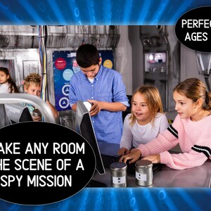 May include: A group of children working together at a computer, with the text "MAKE ANY ROOM THE SCENE OF A SPY MISSION" and "PERFECT FOR AGES 9-12". The setting appears to be an escape room or a similar themed environment.