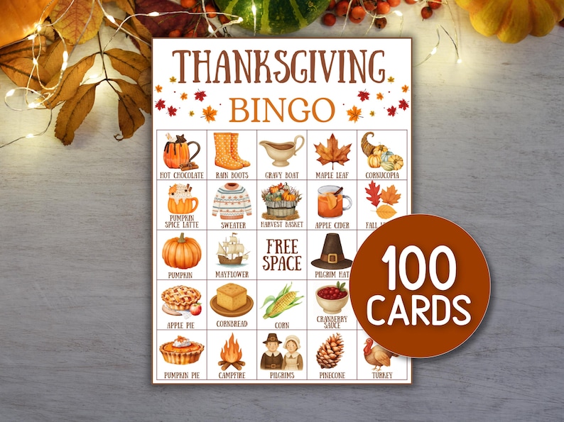 May include: Thanksgiving Bingo game card with colorful illustrations of fall-themed items like pumpkins, cornucopias, and maple leaves. The card includes the text "Thanksgiving Bingo" and "100 Cards" on a circular label.