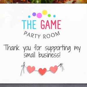 May include: A white card with the text "THE GAME PARTY ROOM" in colorful letters. Below, it reads "Thank you for supporting my small business!" Three pink hearts are strung across the bottom.