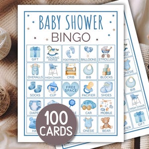 May include: Baby shower bingo cards with blue watercolour illustrations of baby-related items. The cards feature the text "Baby Shower Bingo" and "100 Cards". The illustrations include a rocking horse, bib, and stroller.
