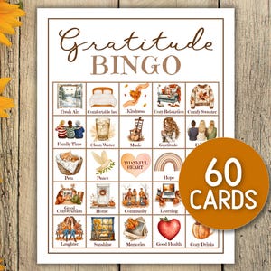 May include: A "Gratitude Bingo" game card with illustrations of various themes like "Family Time" and "Good Health." The card has a brown border and the words "Gratitude Bingo" at the top. A circular sticker on the right says "60 CARDS."