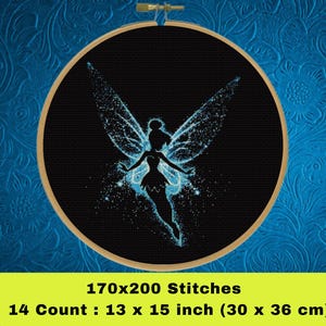 May include: A black and blue cross stitch pattern of a fairy with wings spread wide. The fairy is outlined in blue and has a sparkling effect. The pattern is 170x200 stitches and measures 13 x 15 inches (30 x 36 cm) on 14 count Aida cloth.
