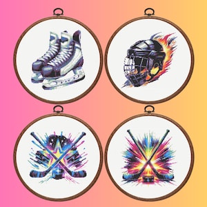 May include: Four circular wooden embroidery hoops containing cross-stitch patterns. The designs feature a pair of white ice skates, a black hockey helmet engulfed in flames, and two variations of crossed hockey sticks with colourful paint splatter effects.
