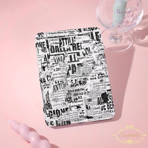 May include: A rectangular e-reader cover featuring a black and white collage of vintage newspaper clippings with various Italian headlines and text, including references to Napoli and dates, presented in a layered, crumpled paper aesthetic.