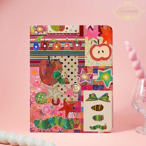 May include: A rectangular notebook featuring a vibrant collage of illustrations including a green caterpillar, various fruits like apples and strawberries, colorful stars, polka dots, and a butterfly. The design incorporates a mix of patterns and shapes.
