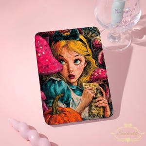 May include: A tablet case with a vibrant illustration of Alice from Alice in Wonderland. Alice, with blonde hair and a blue dress, is holding a bottle with the text "Drink Me". The design includes mushrooms and a pumpkin. A black bow adorns her hair.