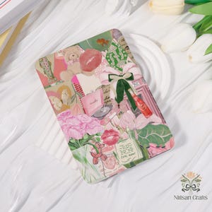 May include: A rectangular phone case with a collage design featuring a teddy bear, pink lips, flowers, and a bottle of soda. The case has a pink and green color scheme with the text "COME AGAIN!"