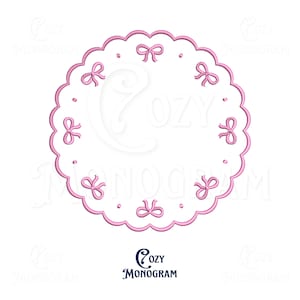 May include: A pink, scalloped-edge design with embroidered bows and dots. The design is circular with the text "Cozy Monogram" at the bottom. The image is on a white background.