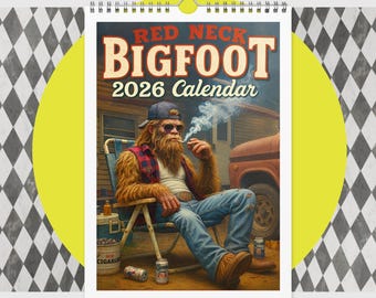 May include: A 2026 calendar titled "Red Neck Bigfoot" features an illustration of Bigfoot smoking a pipe while sitting in a chair. The image includes a cooler, beer cans, and a vintage truck, with the calendar hanging from a spiral binding.
