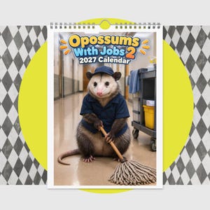 May include: A 2027 wall calendar titled Opossums With Jobs 2 featuring a spiral-bound top. The cover displays an opossum wearing a blue uniform shirt and cap, holding a mop handle in a hallway next to a yellow cleaning cart with a blue cloth.