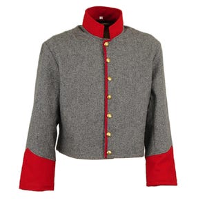 May include: A grey wool jacket with red trim on the collar and cuffs. The jacket has a button-up front and is a traditional style.