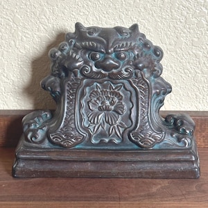 May include: A set of three ceramic vases in varying heights and shapes. The vases feature a matte white finish and a minimalist design, suitable for displaying flowers or as decorative objects. The tallest vase is approximately 10 inches high.