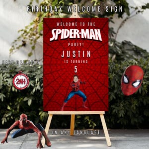 Puede incluir: Un letrero de bienvenida de cumplea&ntilde;os con tem&aacute;tica de Spider-Man sobre un caballete. El letrero presenta un fondo de telara&ntilde;a rojo con el texto "WELCOME TO THE SPIDER-MAN PARTY!" y el nombre "JUSTIN" con el n&uacute;mero "5". Tambi&eacute;n hay un icono de entrega en 24 horas.