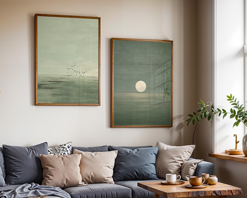 Abstract coastal artwork set of 2 featuring a flock of birds over a tranquil sea and a subtle moon reflection, in soft muted green hues