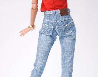 May include: A pair of light blue denim jeans with a brown leather patch on the back waistband.
