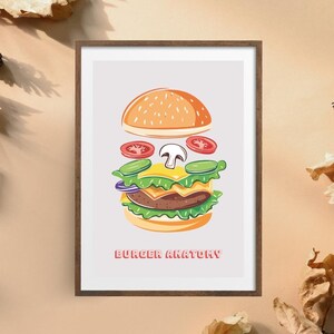 May include: A framed illustration of a burger with the text "Burger Anatomy" at the bottom. The burger is disassembled, showing the individual ingredients: a bun, lettuce, tomato, cheese, a mushroom, and a patty.
