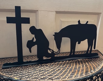 Praying Cowboy and horse standing sign