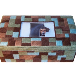 May include: A brown, green, and blue patterned wooden box with a photo frame insert. The photo frame shows a dog peeking out from behind a door.