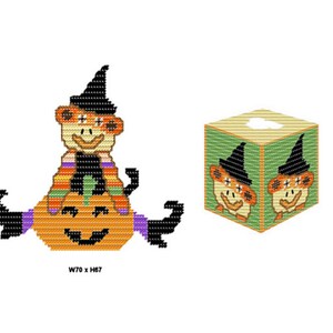 May include: A Halloween-themed tissue box cover with a pumpkin and two orange monkeys wearing witch hats. The monkeys are sitting on the pumpkin, which has a black face and a wide smile. The tissue box cover is made of felt and is approximately 70 inches wide by 67 inches high.