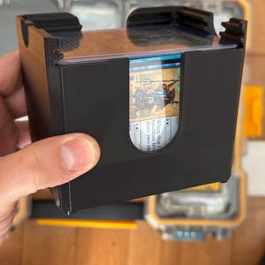 May include: A white ceramic mug with a black handle and the text "But First, Coffee" in a black, bold font. The mug is on a white surface.