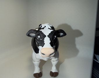 3D printed articulated cow (toy different heads)