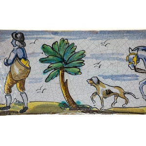 May include: Rectangular ceramic tile with a hand-painted scene. A figure in blue and yellow clothing walks with a bag, followed by a dog and a horse-drawn carriage. The background features a palm tree and birds against a sky.