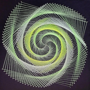 May include: A geometric string art piece featuring a spiral design. The artwork uses shades of green and white thread against a black background. The spiral is formed by threads stretched between small nails.