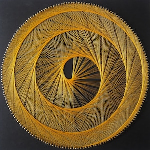 May include: A circular string art piece with a yellow thread woven in a spiral pattern on a black background.