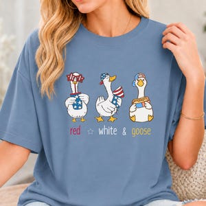 Bella Canvas 4th of July shirt with cute patriotic geese, red white and goose design, funny USA tee for Independence Day, BBQ parties, fireworks, parades, and summer gifts.