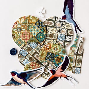 May include: A selection of decorative coasters with vibrant, patterned designs, featuring floral and geometric patterns. The image also includes swallow bird cutouts and bottle-shaped decorations, set against a white backdrop.
