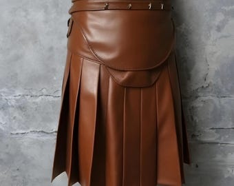 May include: A brown leather skirt with pleats and a wide belt. The skirt has a unique design with multiple layers and a curved front panel.