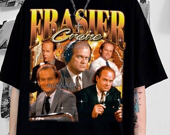 May include: Black t-shirt featuring a graphic design with the text "FRASIER Crane" in gold and a collage of images of the character. The design has a vintage, retro style with a cityscape background.