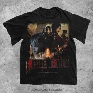 May include: Black t-shirt featuring a distressed graphic from the video game Resident Evil. The design includes characters, the game's title in red, and the Etsy shop's URL at the bottom. The shirt has a vintage look.