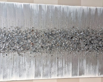 May include: A silver and white abstract painting with a textured, glittery finish. The painting features a horizontal band of silver glitter across the centre, with vertical lines of silver glitter on either side.