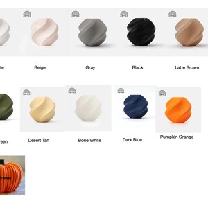 May include: A collection of decorative, spiral-shaped vases in various colors, including white, beige, gray, black, and brown. Additional colors are dark green, tan, bone white, dark blue, and pumpkin orange. A matte orange pumpkin is also shown.