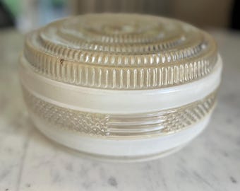 May include: A round glass light fixture shade featuring a clear, textured top with concentric ribbed patterns and a central section of frosted white glass. The lower portion includes a clear band with a cross-hatched diamond pattern texture.