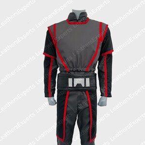 May include: A gray and black costume with red trim. The outfit includes a high-collared top, pants, and a wide belt with a silver design. The sleeves and legs have red accents. The costume is displayed on a mannequin.