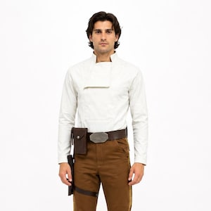 May include: A long-sleeved off-white shirt with a high collar, brown trousers featuring a side stripe, a dark brown leather belt with a metallic buckle, a small attached pouch, and black knee-high boots. The outfit is worn as a complete set.