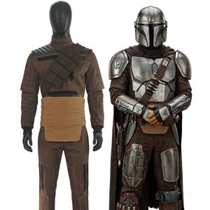 Front View of the Din Djarin Mandalorian Beskar armor and brown canvas flight suit. High-quality professional cosplay showing full weathered silver Beskar plates beside a display mannequin wearing the matching quilted cummerbund and flight suit. Perfect for 501st Legion approval