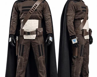 May include: A brown long-sleeved tunic and trousers set with a black cape, a white quilted waist panel, and a brown utility belt featuring a holster and pouches. The outfit includes black gloves with silver accents and a diagonal shoulder strap.