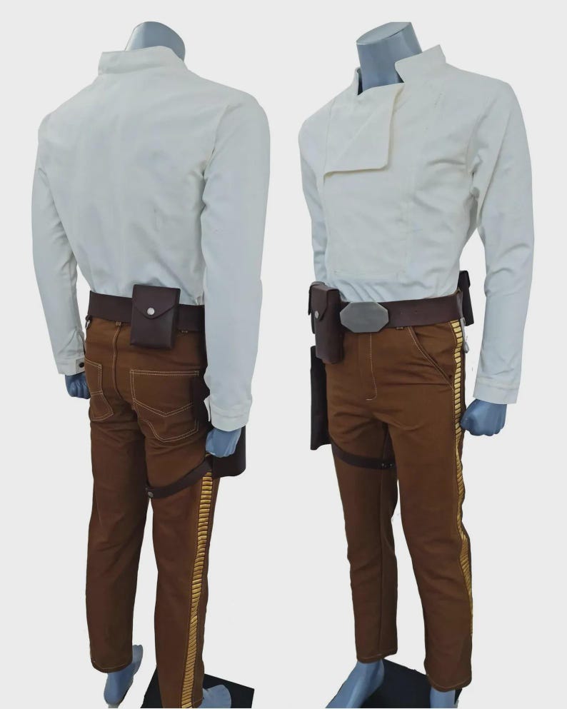 May include: A costume set featuring a long-sleeved white shirt with a high collar, brown trousers with gold-coloured side stripes, and a dark brown utility belt with a holster and a small pouch, displayed on two mannequins from front and back.