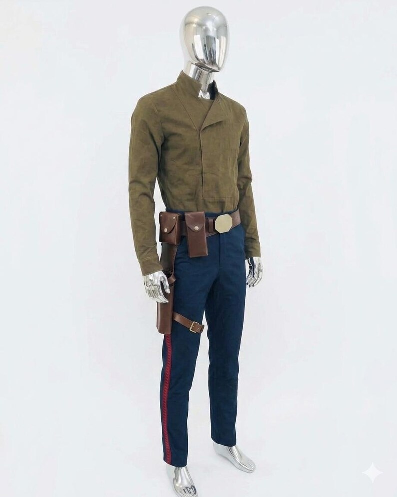 May include: A costume comprising a brown jacket, navy blue trousers with a red stripe, and a brown belt with pouches. The jacket features a mandarin collar and long sleeves. The belt has a gold buckle. The costume is displayed on a mannequin.