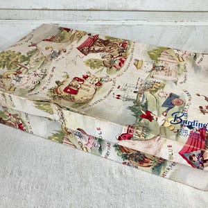 May include: Vintage rectangular box with a colorful, illustrated pattern featuring nursery rhyme scenes. The box has a cream-colored background with images of characters and text from classic children's stories. The brand name "Barding's" is visible on the side.