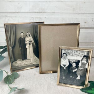 May include: A set of three ceramic mugs with a speckled, matte finish. The mugs are in shades of cream, light gray, and dark gray. Each mug has a simple, minimalist design, perfect for coffee or tea.