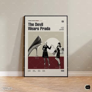 May include: A movie poster for the film "The Devil Wears Prada" featuring a red background with a large black high heel shoe, two women in black and white outfits, and the film's title in white text.