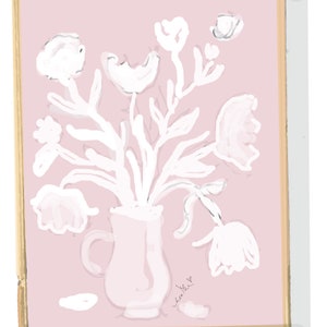 May include: A digital art print of a bouquet of white flowers in a pink pitcher against a pink background. The artwork is framed in a gold-colored border. The style is minimalist and elegant.