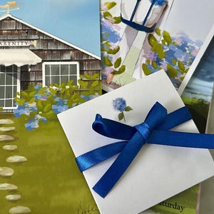 May include: An artistic composition featuring a white card tied with a blue ribbon, a calendar, and illustrations of a house and a person with a tote bag filled with blue hydrangeas. The house illustration has the word "Serenity" on it.