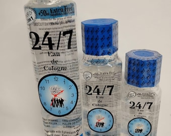 May include: Three bottles of 24/7 Eau de Cologne in different sizes. The bottles are clear glass with blue caps and labels. The labels feature a clock face with a group of people pulling a rope. The text on the labels reads "24/7 Eau de Cologne" and "+50ml Extra Free".