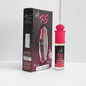 May include: A perfume bottle and box set. The bottle has a red cap and a clear glass body with a dark liquid. The box is black with red accents and the text "KS SPARX Extra Pleasure Royal Fragrance". The set is for apparel use only.