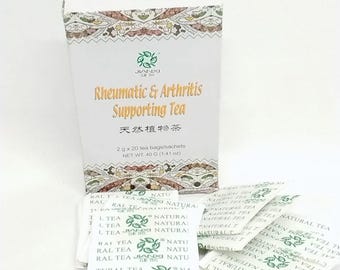 May include: A white box of "Rheumatic & Arthritis Supporting Tea" with gold lettering and Chinese characters. The box contains 20 tea bags/sachets, each weighing 2 grams (0.07 oz). The box has a decorative pattern.